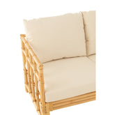 Rotan bank met witte kussens van J-Line als sfeerbeeld
