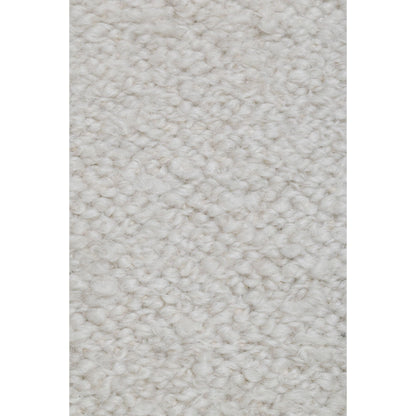 Detail van het ivoorkleurige Noble vloerkleed van MUST Living met gemeleerde structuur